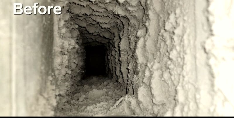 The inside of a rectangular duct run, the walls caked with grey dust. The word Before is written in the corner.
